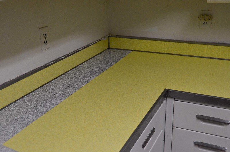 yellow colored contact paper countertop in a kitchen