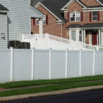 White vinyl fence in residential neighborhood