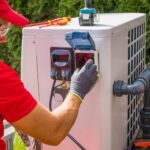 Outdoor Swimming Pool Heat Pump Maintenance by a technician