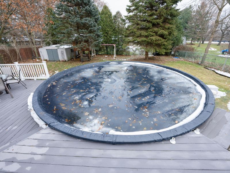 pool has been winterized and cover is in place 
